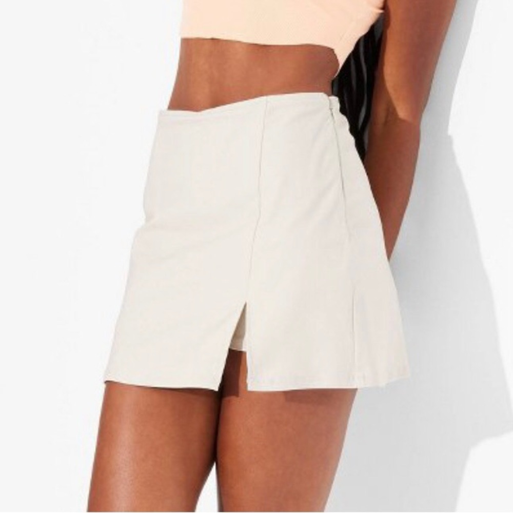 Mini skirt with built in shorts size XS light beige